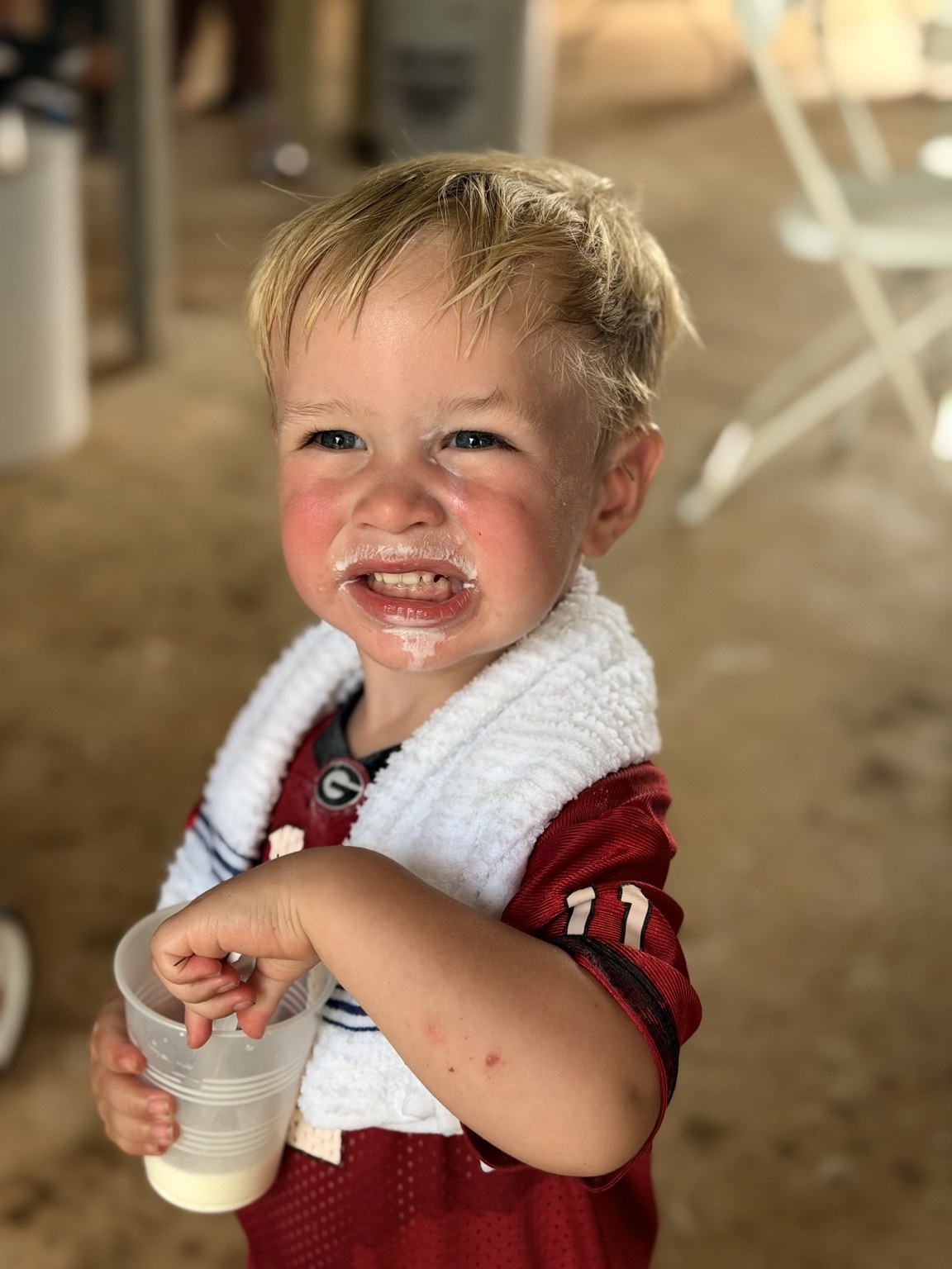 A smiling young visitor at the farm